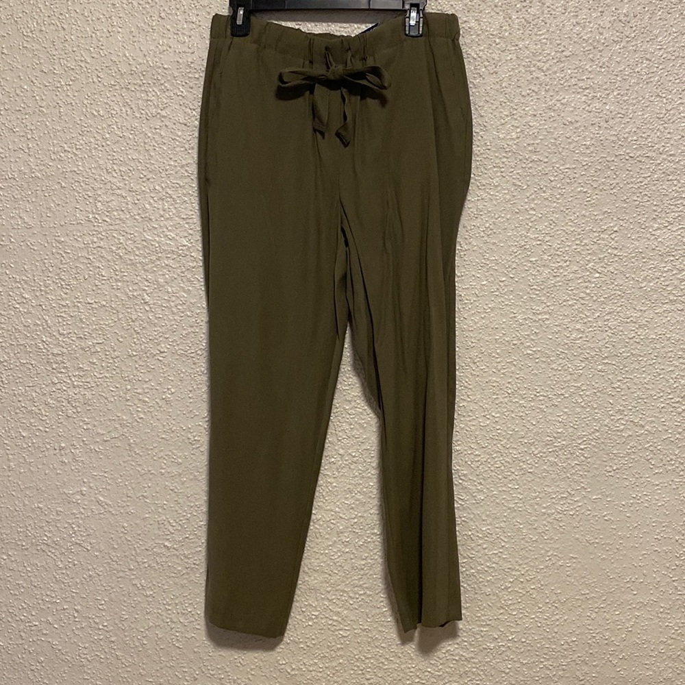 Olive green casual pants with a belt tie.
